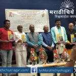Bharat Sasane speaking at literary award event in Pune, highlighting the neglect of children's literature review in Marathi